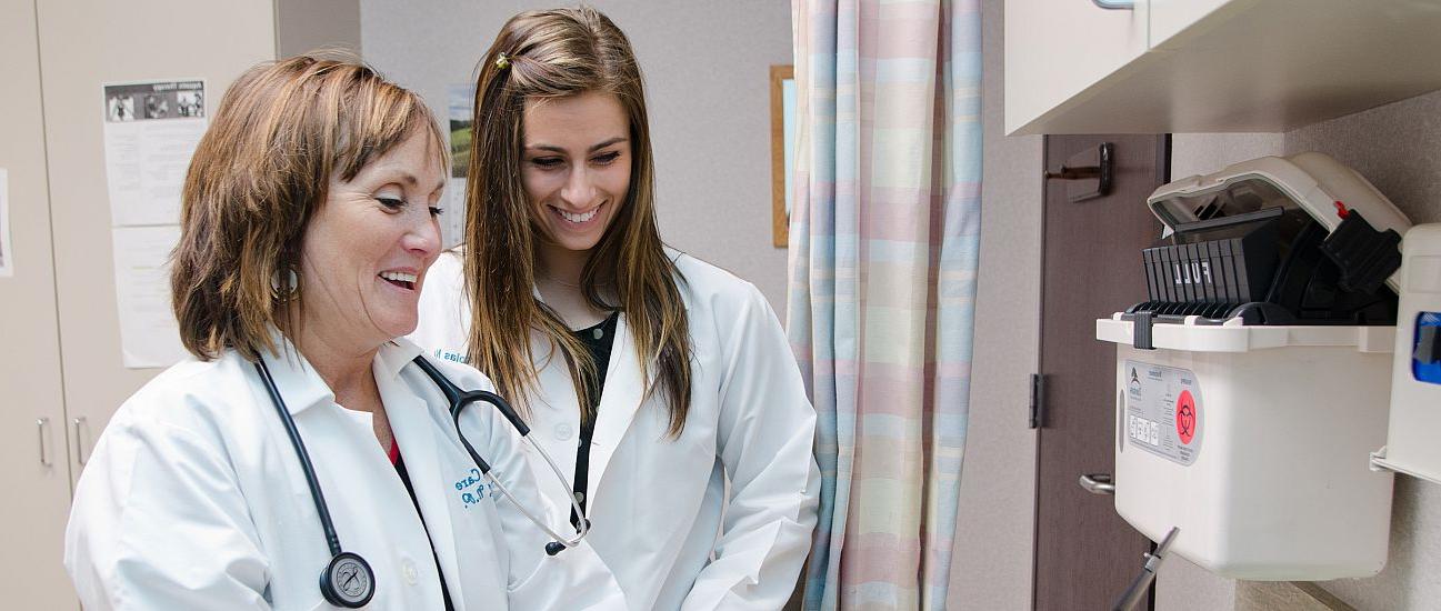 Alyse Mikolas '14 shadows her mother, Sandra, a nurse practitioner, at Aurora Health Center in Kenosha. A new program designed by Sandra ...